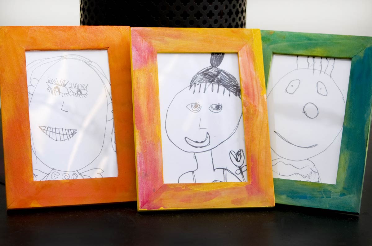 watercolour picture frames with pen drawings by children