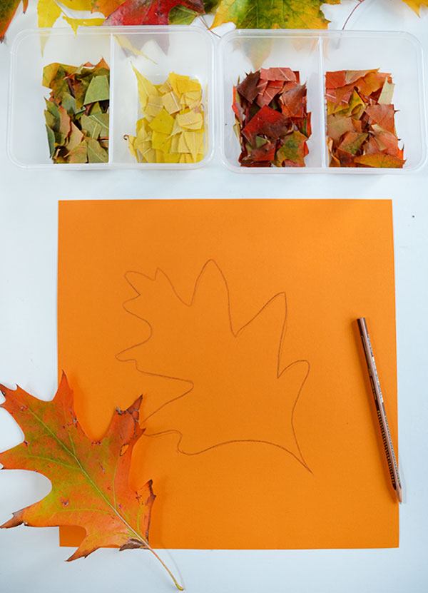 orange paper with leaf shape drawn on it