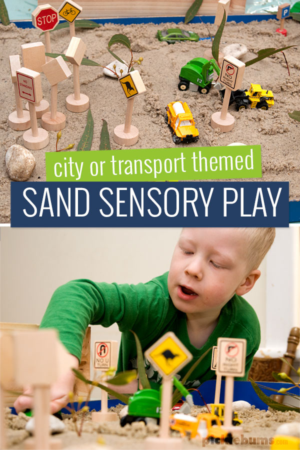 sand sensory play with cars and road signs