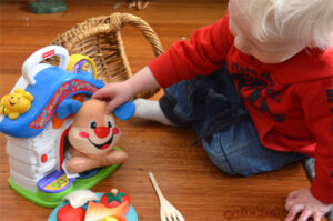 Noah playing with puppy