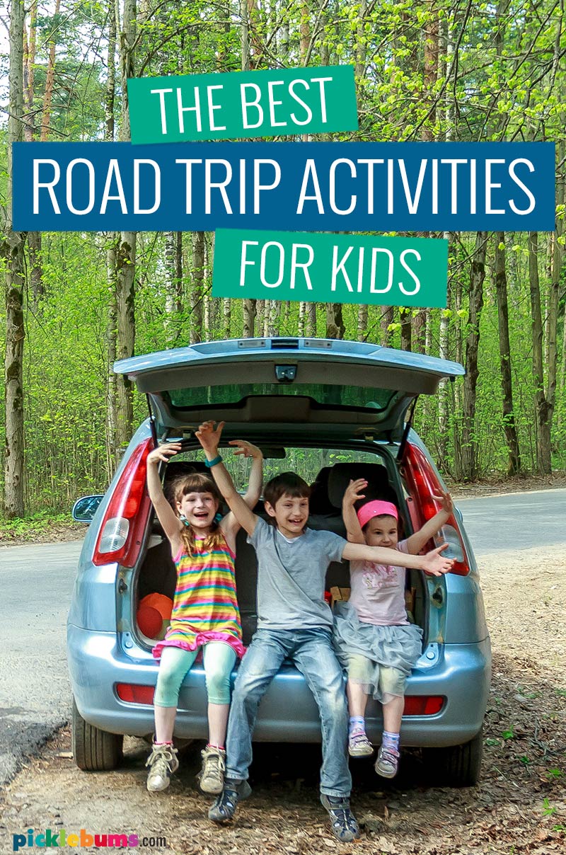 three children sitting in the trunk of a car on the side of the road, text saying 'the best road trip activities for kids'