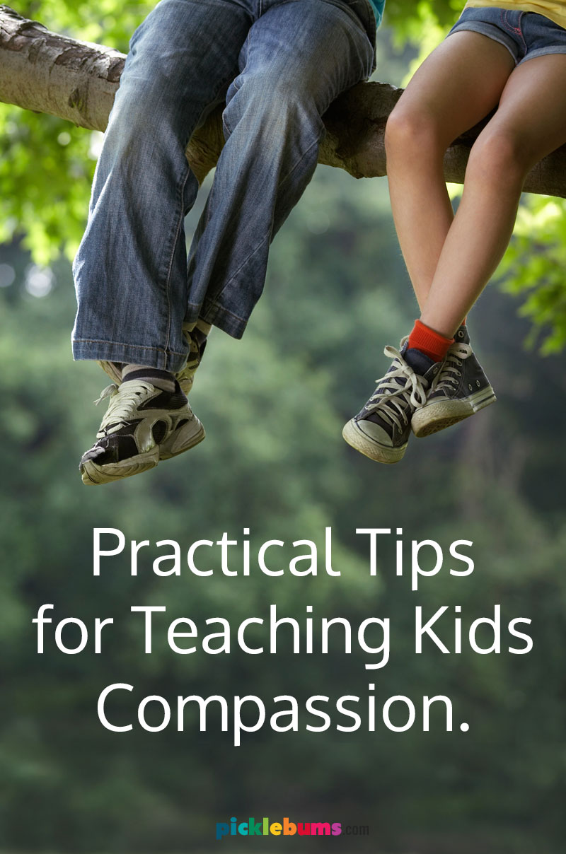 two kids legs sitting on a tree branch with text - practical tip for teaching kids compassion