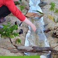 Make a River - imaginative play in the sand pit!