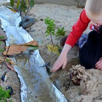 Make a River - imaginative play in the sand pit!