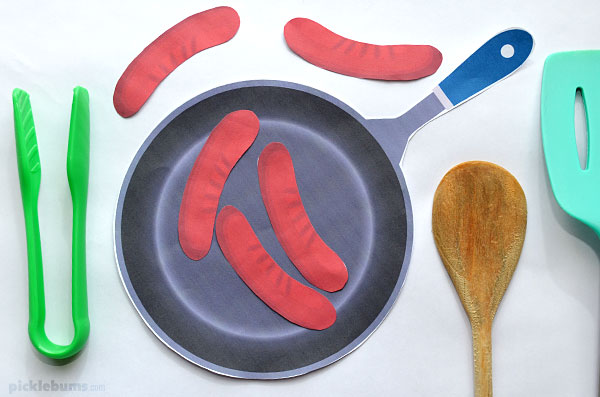 paper sausages and paper pan with utensils