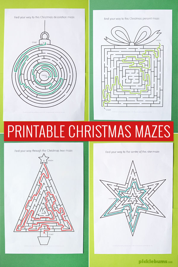 Four printed Christmas mazes with solutions on coloured background