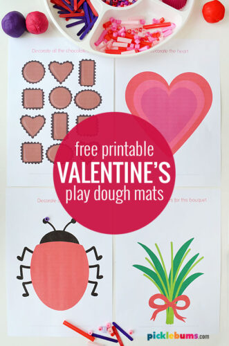 Four printed Valentine's day themed playdough mats, chocolates, heart, love bug, and flowers