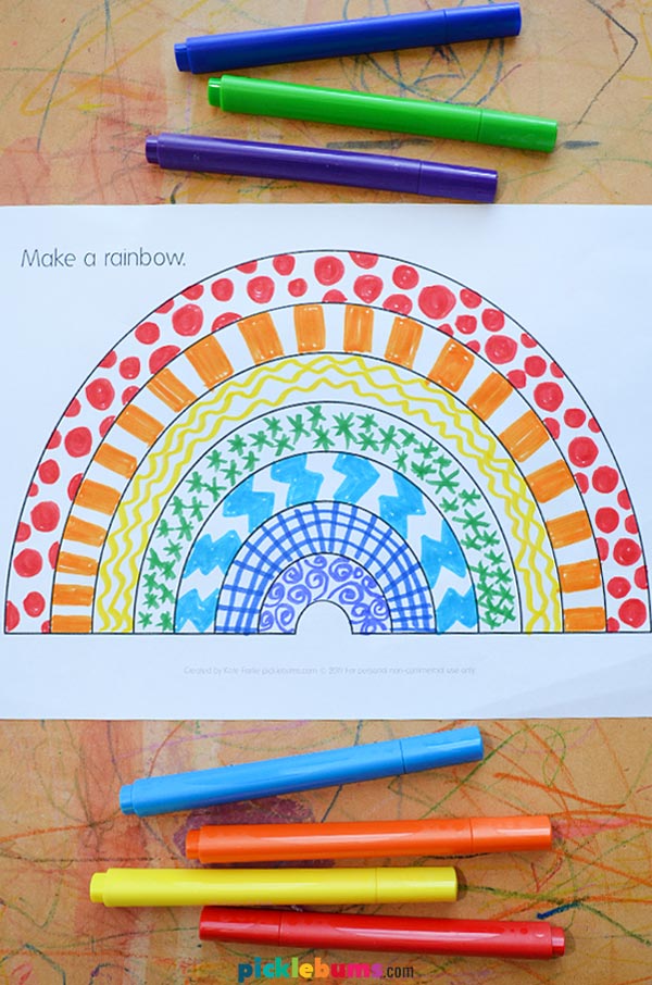 rainbow templated filled in with patterns next to markers