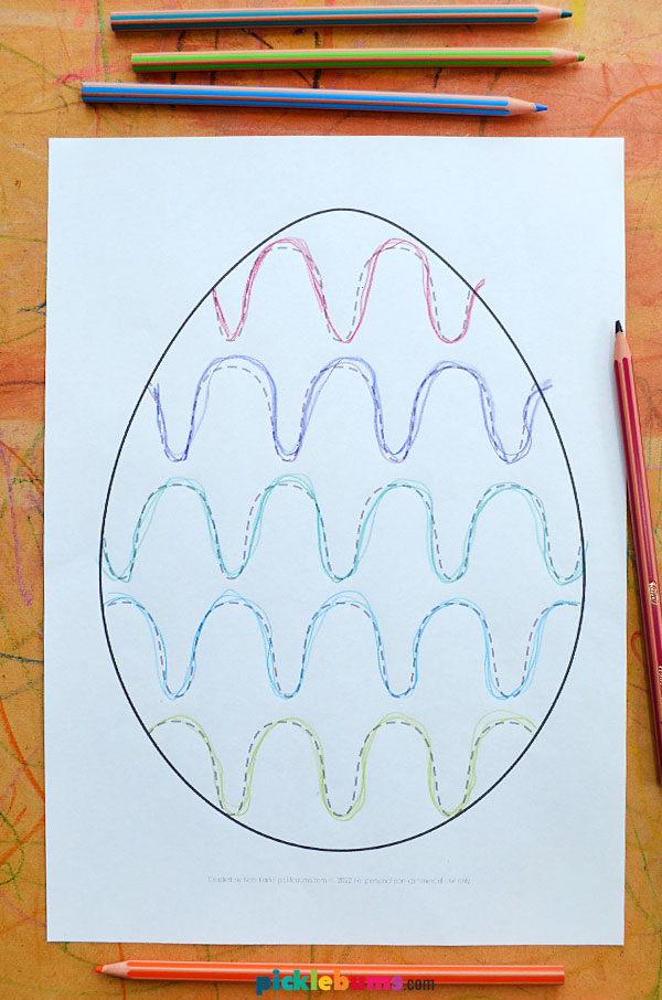 Egg pattern mat and coloured pencils