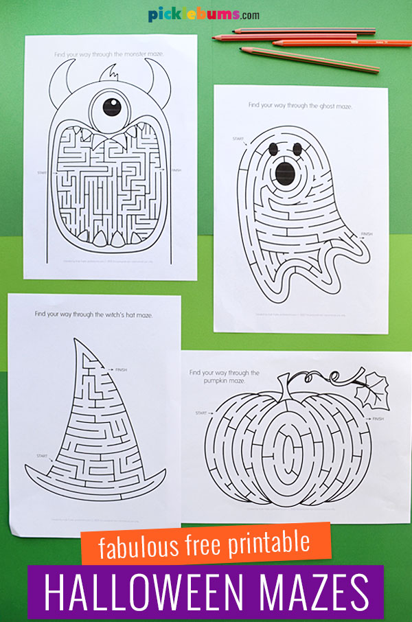 four Halloween maze printables on green background