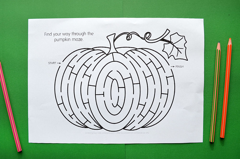 pumpkin maze worksheet on green background