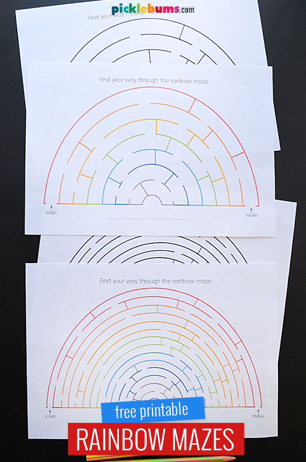 printed rainbow mazes in coloure and black and white on black background 