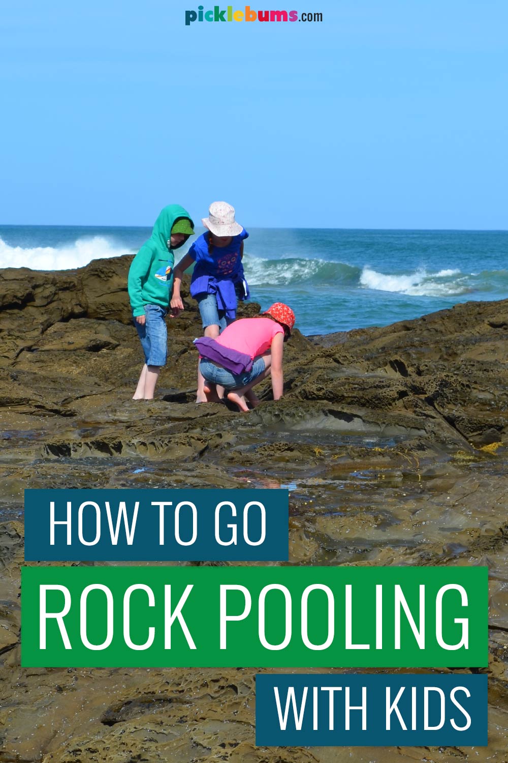 three kids rock pooling