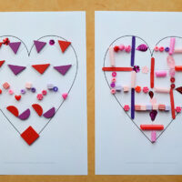 two printed heart pattern mats with loose parts