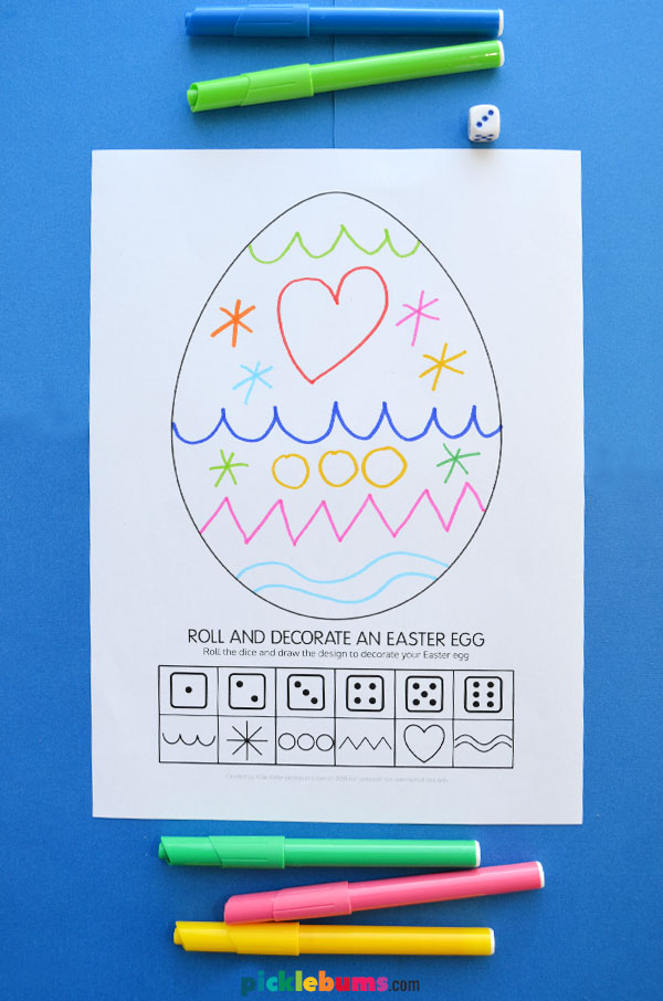 Free printable Easter egg dice game on blue background with markers and dice